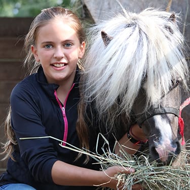 Adopt An Animal Horses - Camper with miniature horse - Cub Creek Science and Animal Camp