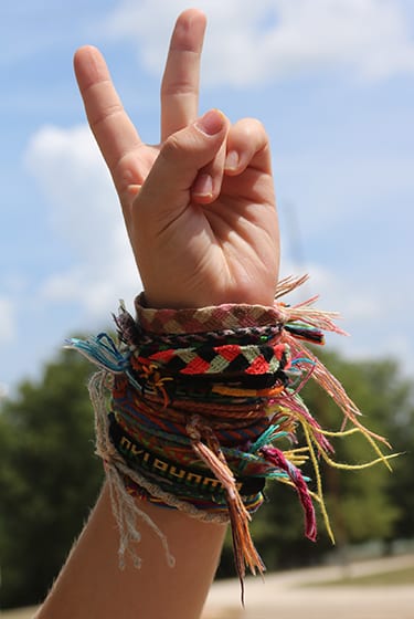 Arts & Crafts At Camp - Camper friendship bracelets peace sign - Cub Creek Science and Animal Camp