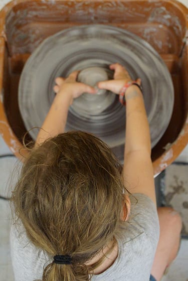 Arts & Crafts At Camp - Pottery - Camper learning pottery wheel - Cub Creek Science and Animal Camp