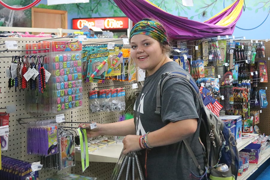 Camp Store - Camper looking through camp store items - Cub Creek Science and Animal Camp