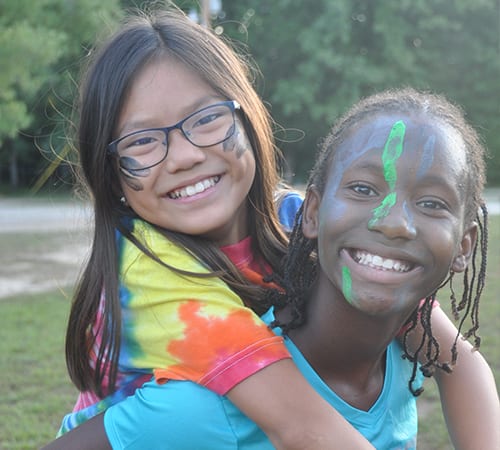 Daily Schedule - Happy campers piggy back ride - Cub Creek Science and Animal Camp