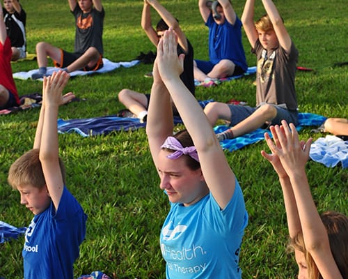 Early Birds & Night Owls - Campers doing morning yoga - Cub Creek Science and Animal Camp