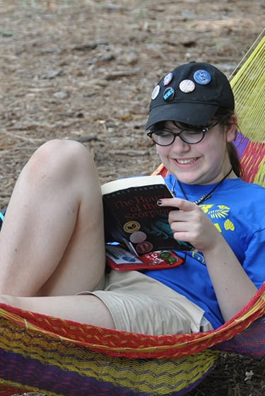 Even More At Camp - Camper reading in the hammocks - Cub Creek Science and Animal Camp