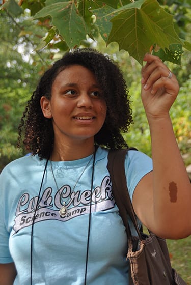 Nature At Camp - Junior Naturalist - Camper learning about native Missouri leaves - Cub Creek Science and Animal Camp