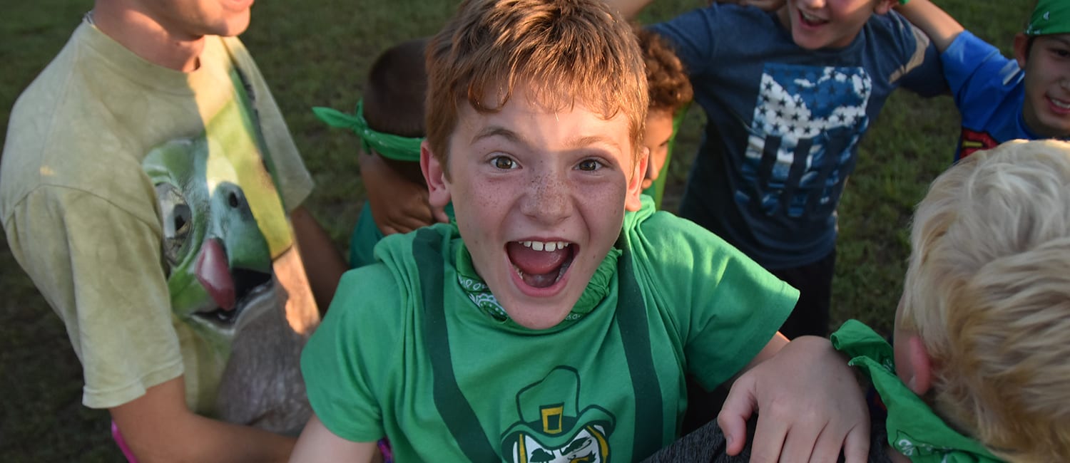 Paperwork And Payments - Excited camper during evening activity - Cub Creek Science and Animal Camp